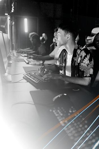 Gamers playing on PCs at an event using Chromaport for seamless, high-performance and low-latency remote game streaming.